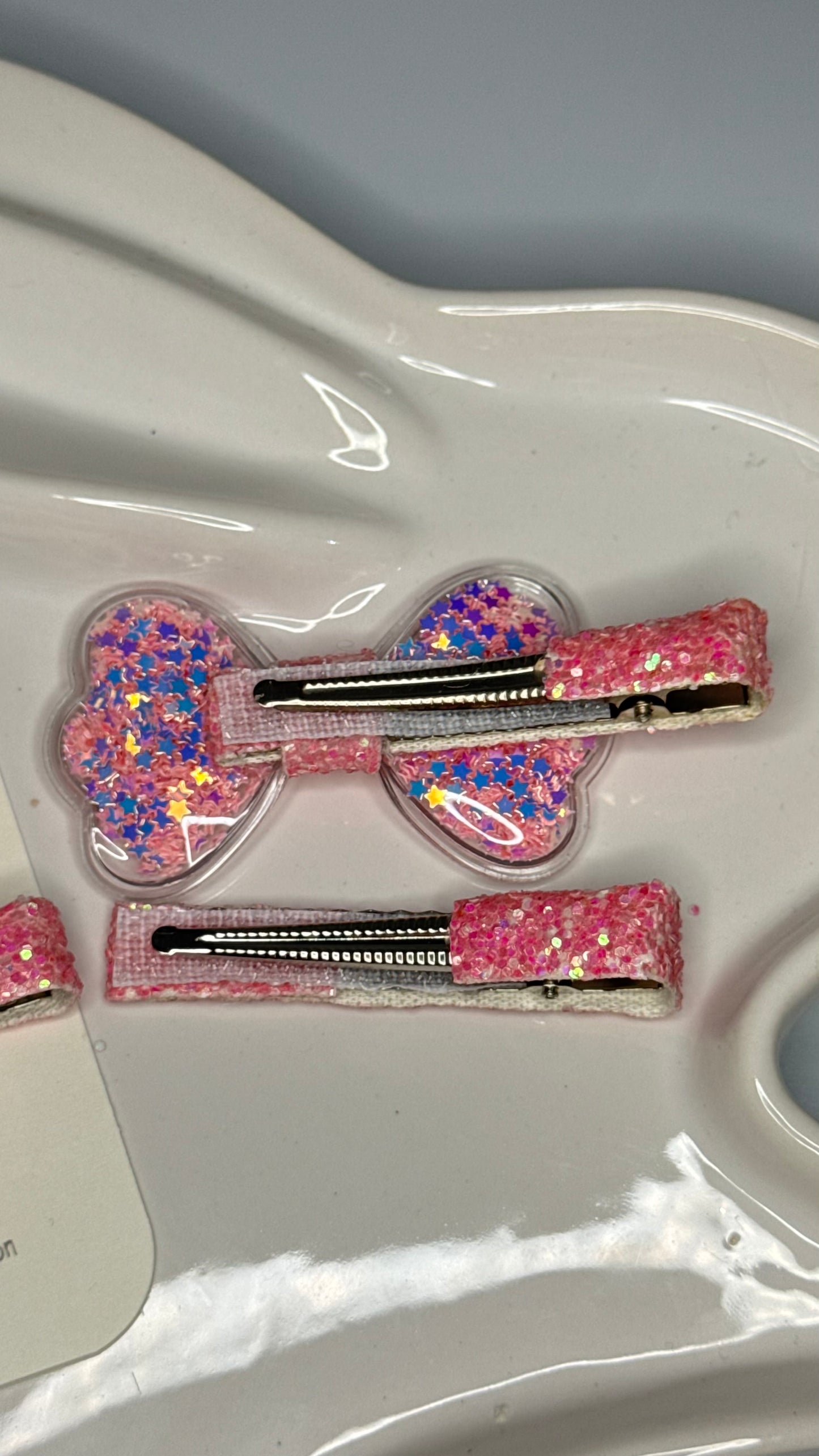 Shiny pink bow hair clip