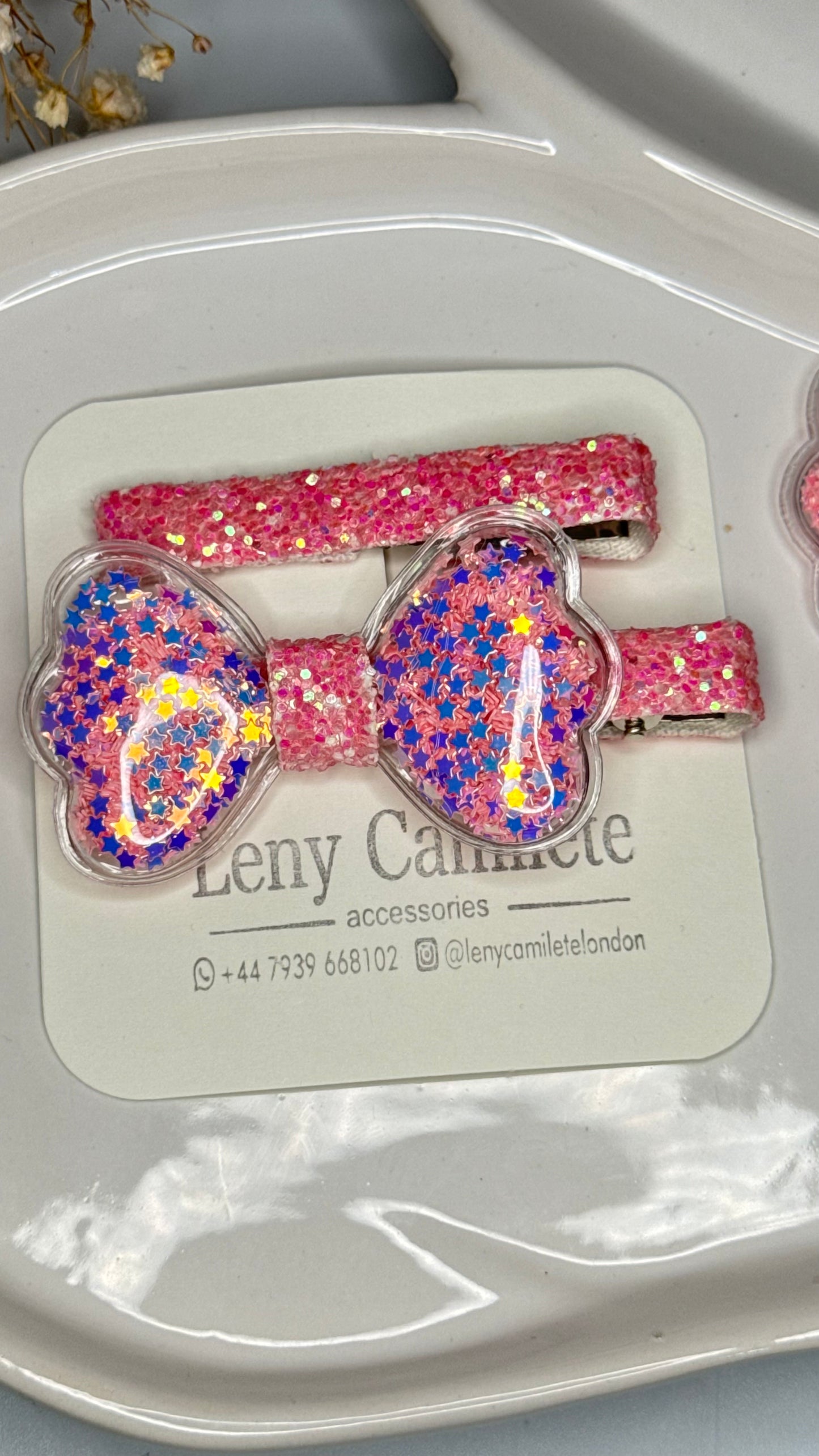 Shiny pink bow hair clip