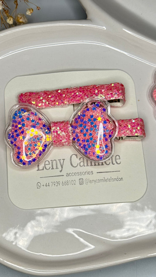 Shiny pink bow hair clip